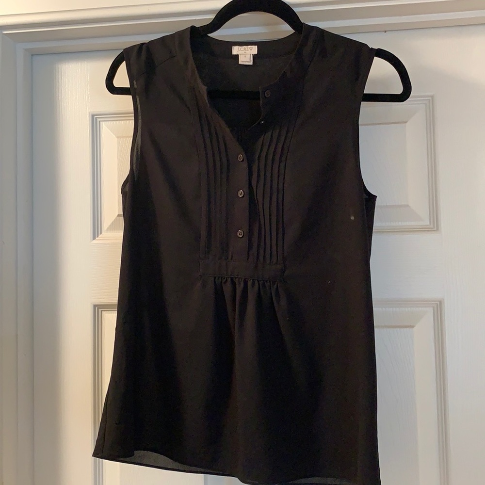 Sleeveless black button down blouse